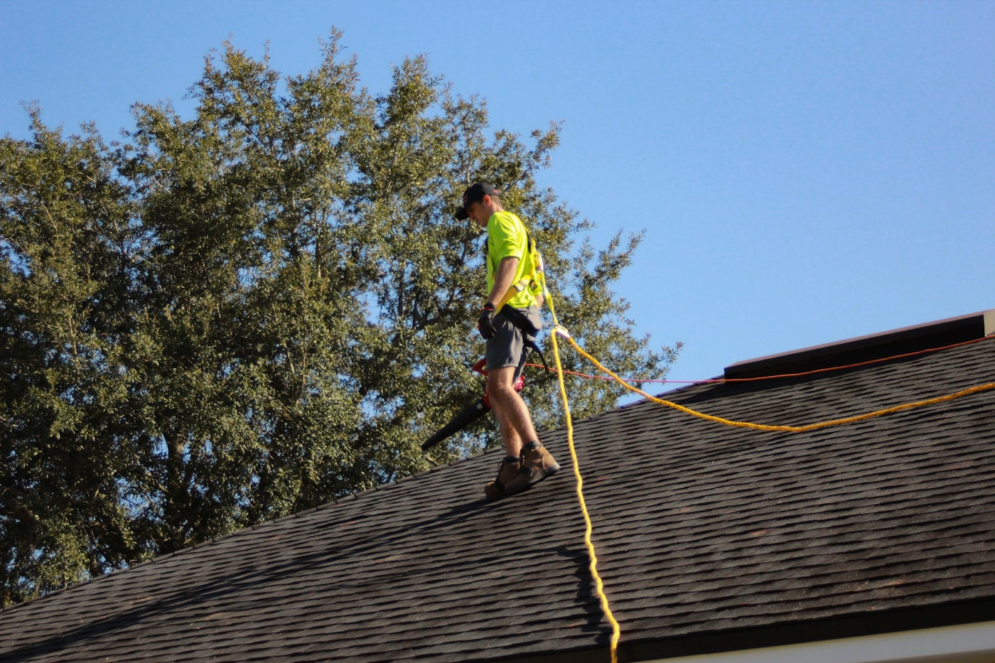 Professional roof repair work on residential shingles